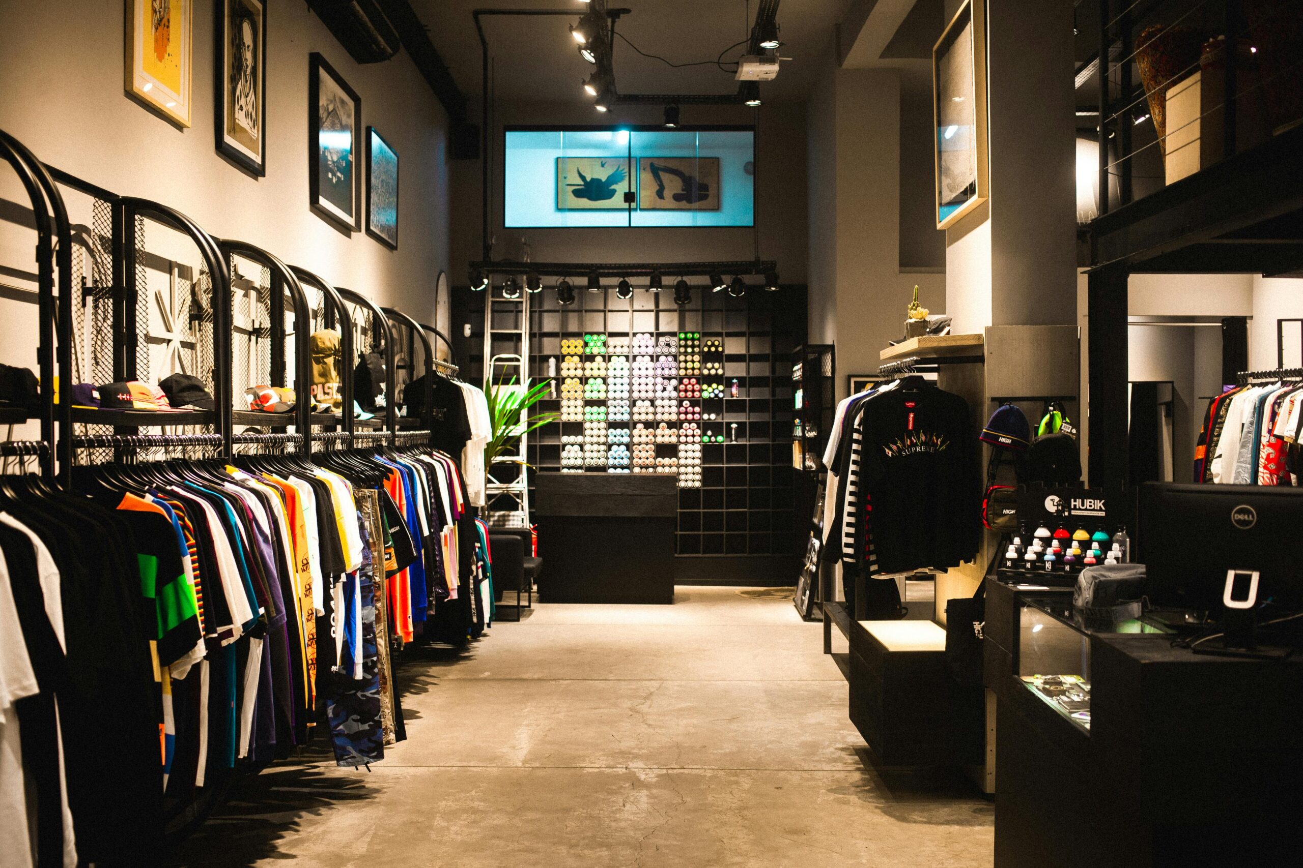 Explore the stylish interior of a modern urban fashion store with vibrant clothing displays.